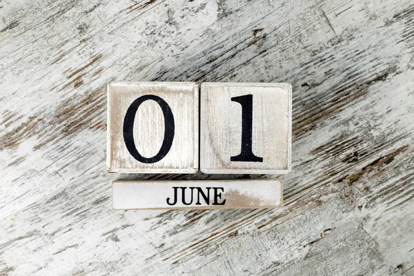 wooden calendar with date the first of june