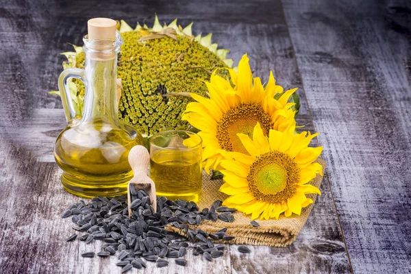 Sunflower, sunflower oil and sunflower seeds, background