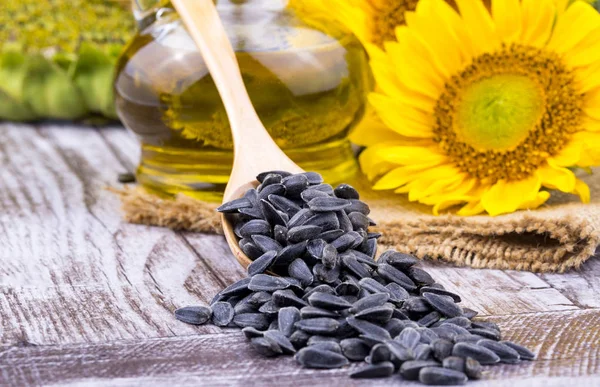 Sunflower, sunflower oil and sunflower seeds, background