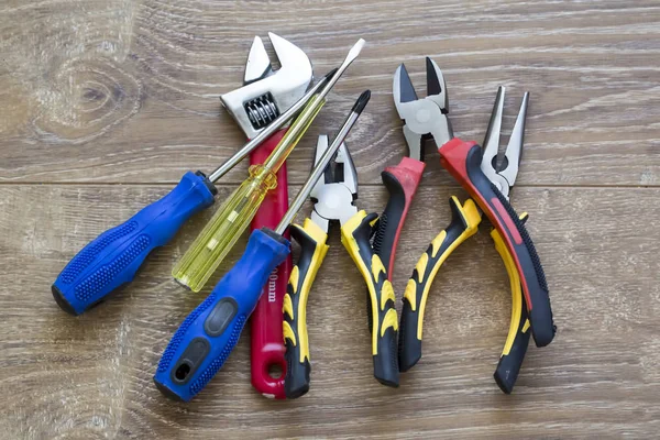 Set of tools, Many tools isolated on wooden background.