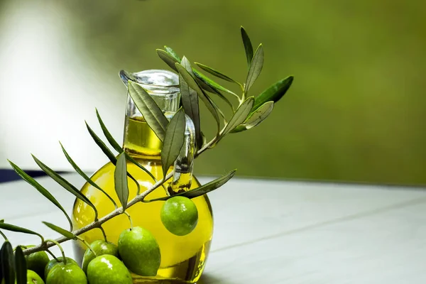 Green fresh olive and olive oil isolated.