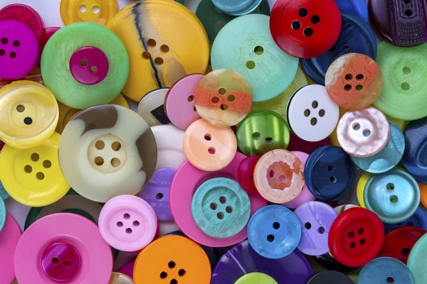Cucire bottoni di sfondo. Colorato cucitura texture pulsanti — Foto Stock