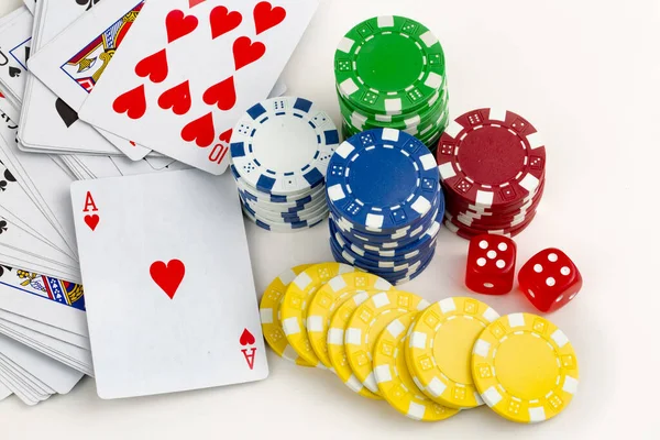 Ace playing cards with red dice. Casino betting and gambling concept and poker chips.