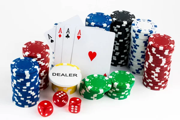 Ace playing cards with red dice. Casino betting and gambling concept and poker chips.