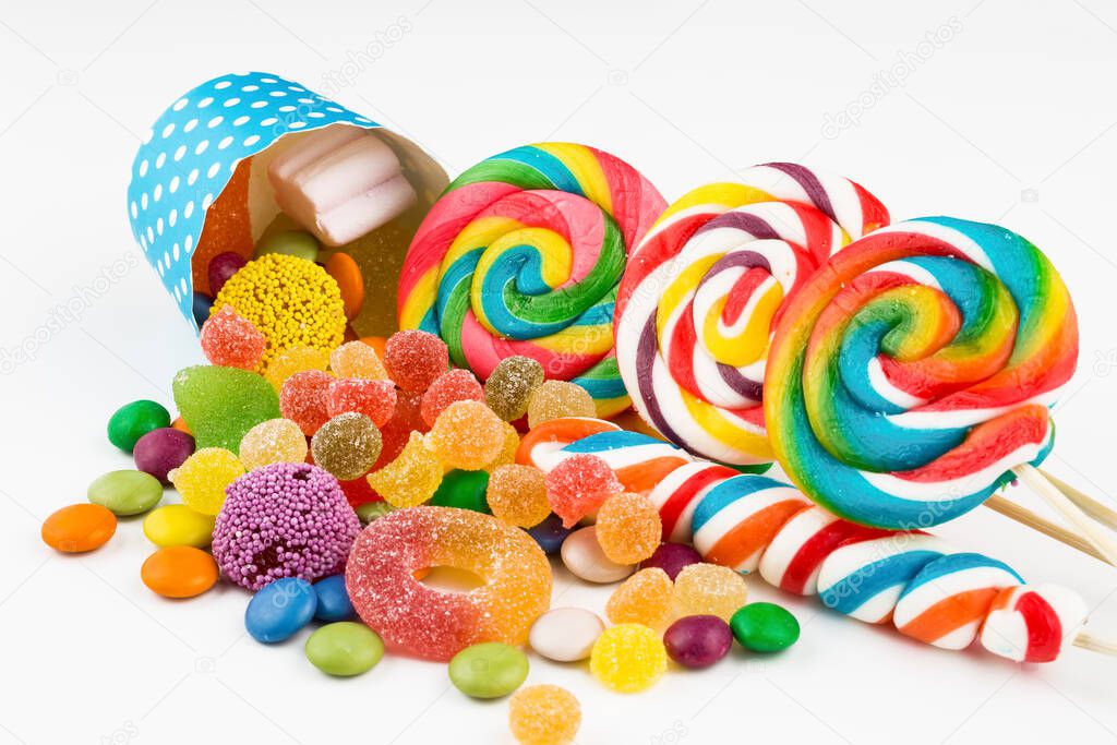 Colorful lollipops and different colored round candy. Top view.