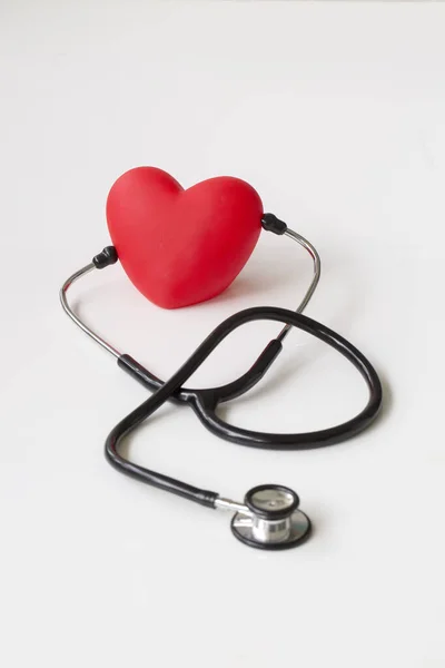 Stethoscope and red heart. Heart Check. Concept healthcare.