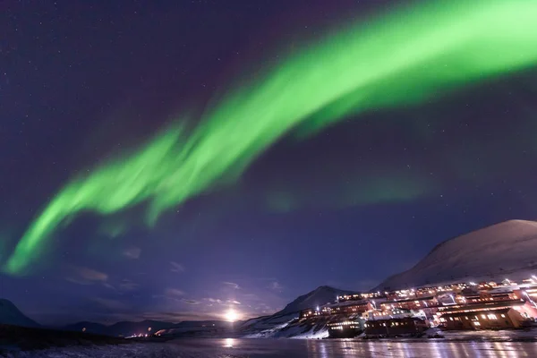 The polar arctic Northern lights aurora borealis sky star in Norway Svalbard in Longyearbyen city  mountains