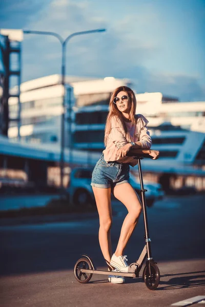 Beautiful Young Girl Denim Shorts Riding Electric Scooter Sunglasses Long Royalty Free Stock Photos