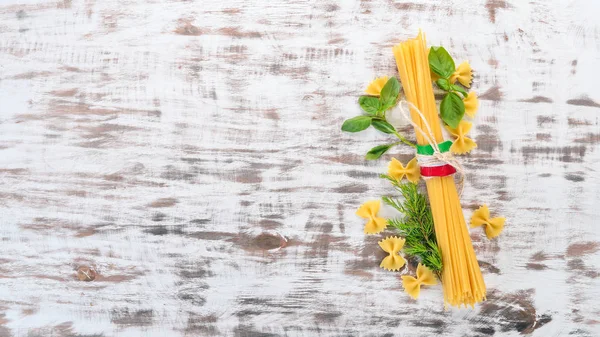 Italian Cuisine Dry Pasta Basil Wooden Background Top View Copy — Stock Photo, Image