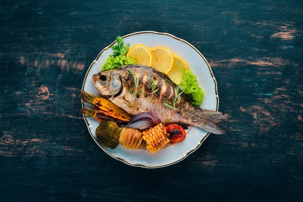 Baked fish carp. On a wooden background. Top view. Copy space. — Stock Image Baked Fish Carp Wooden Background Top View Copy Space Stock Image