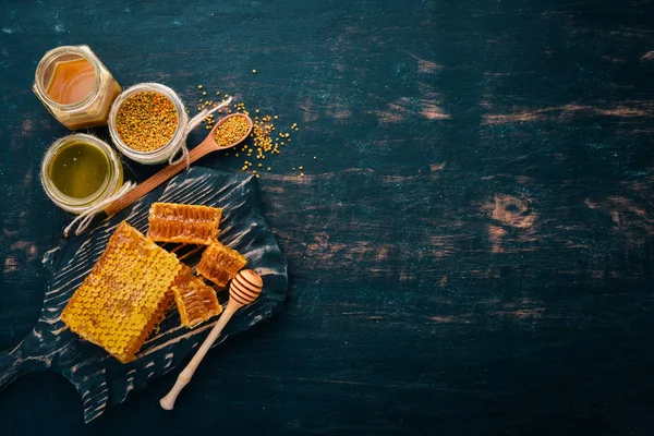 Set Honey Bee Products Honey Honeycomb Black Wooden Background Free — Stock Photo, Image