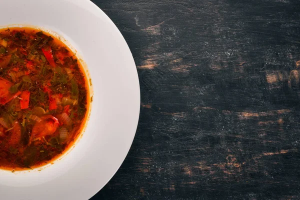Vegetable soup kharcho. On the old wooden background. Free space for text. Top view. — Stock Image Vegetable Soup Kharcho Old Wooden Background Free Space Text Top Stock Image
