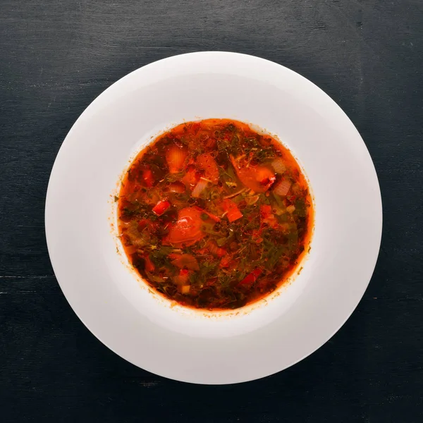 Vegetable soup kharcho. On the old wooden background. Free space for text. Top view. — Stock Image Vegetable Soup Kharcho Old Wooden Background Free Space Text Top Royalty Free Stock Images