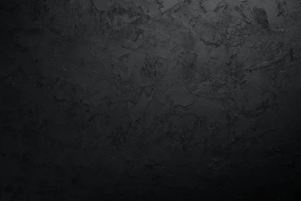 Siyah taş arka plan. Siyah yüzey. Üst Manzara. Metnin için boş yer.