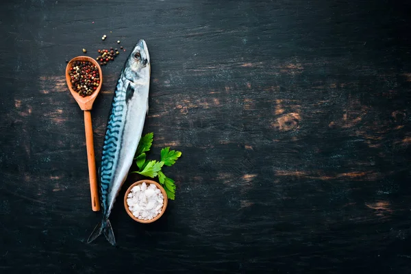 Fish. Raw Mackerel on a black wooden background. Top view. Free copy space. — Stock Image Fish Raw Mackerel Black Wooden Background Top View Free Copy Stock Photo