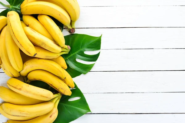 Banana Green Leaves White Wooden Table Tropical Fruits Top View — Stock Photo, Image