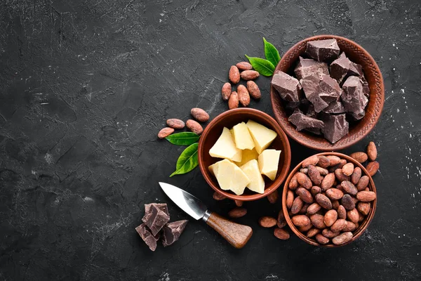 Chocolate, cocoa beans, cocoa butter. Chocolate Background Top view. Free copy space.