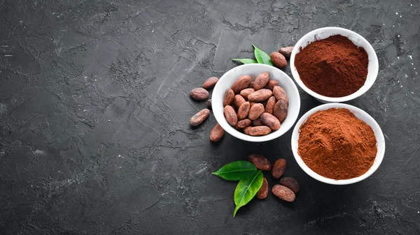 Cocoa beans, cocoa powder is dark and light. On a white background. Top view.