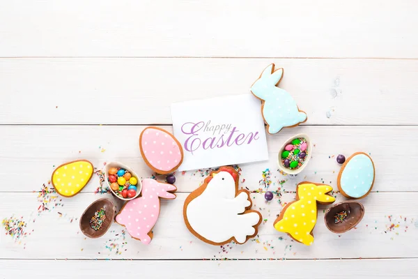 Easter Greetings Card Colorful Gingerbread Sweets White Wooden Background Top — Stock Photo, Image