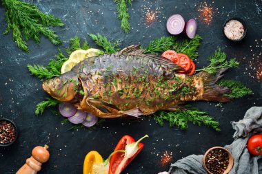 Fırında Sebzeli Balık Sazan. Üst te. Metniniz için boş alan. Rustik stil.