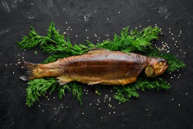 Sebzeli Fırında Alabalık. Üst te. Metniniz için boş alan. Rustik stil.