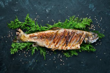 Sebzeli Fırında Alabalık. Üst te. Metniniz için boş alan. Rustik stil.