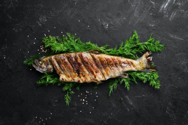 Sebzeli Fırında Alabalık. Üst te. Metniniz için boş alan. Rustik stil.