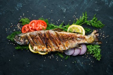 Sebzeli Fırında Alabalık. Üst te. Metniniz için boş alan. Rustik stil.