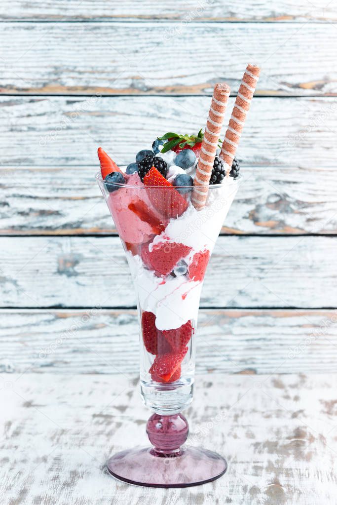 Ice-cream with wild berries. Dessert. Top view.
