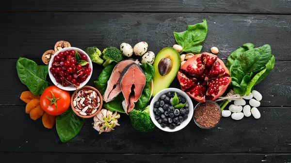 Healthy Food Fish Blueberries Nuts Pomegranate Avocados Tomatoes Spinach Flax — Stock Photo, Image