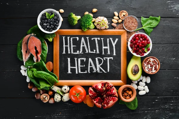 Food Heart Health Fish Blueberries Nuts Pomegranate Avocados Tomatoes Spinach — Stock Photo, Image