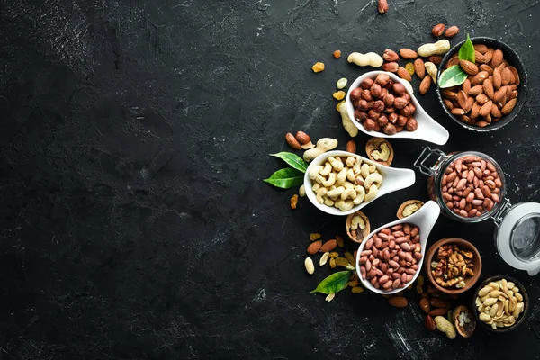 Assorted Nuts Old Black Background Top View Free Space Your — Stock Photo, Image