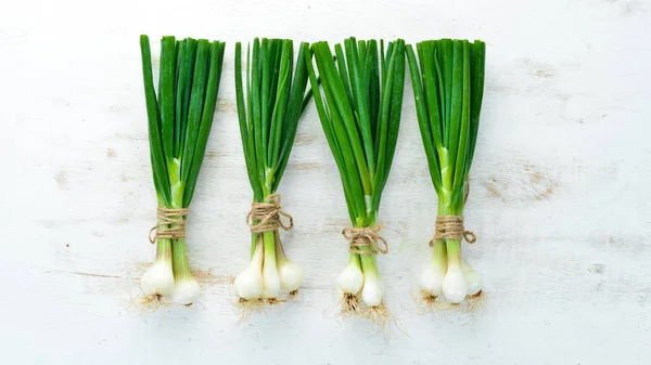 Green Onion White Wooden Background Top View Free Space Text — Stock Photo, Image