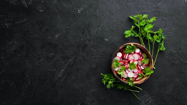 Sliced radishes on a Wooden Table. Fresh vegetables. Top view. Free space for text.