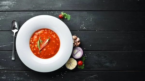 Tomato soup with corn and vegetables. On a wooden background. Top view. Free space for your text. — Stock Image Tomato Soup Corn Vegetables Wooden Background Top View Free Space Royalty Free Stock Photos