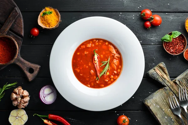 Tomato soup with corn and vegetables. On a wooden background. Top view. Free space for your text. — Stock Image Tomato Soup Corn Vegetables Wooden Background Top View Free Space Stock Photo