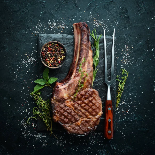 Grilled Cowboy Beef Steak Herbs Spices Black Stone Background Barbecue — Stock Photo, Image