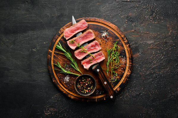 Juicy Steak on the knife. Top view. Free space for your text.