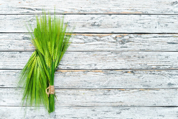 Rye on a white wooden table. Top view. Free space for your text.