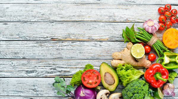 Fresh raw vegetables on a white background Wooden. Top view. Free space for your text.