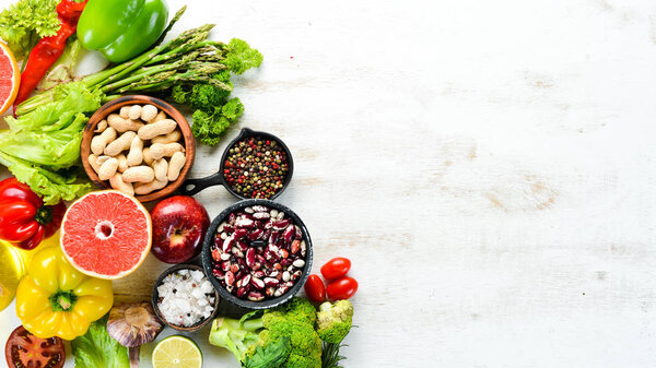 Organic food Fresh vegetables and fruits on a white background. Top view. Free copy space.