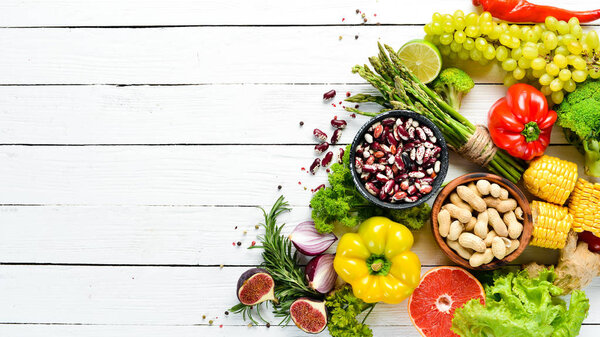 Organic food Fresh vegetables and fruits on a white background. Top view. Free copy space.