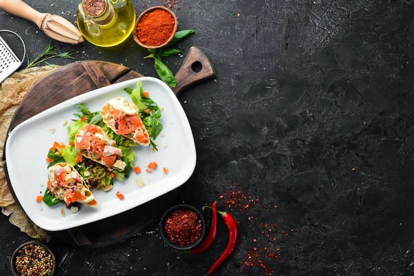 Avocado, salmon and egg sandwich. Restaurant dishes. Top view. Free space for your text.