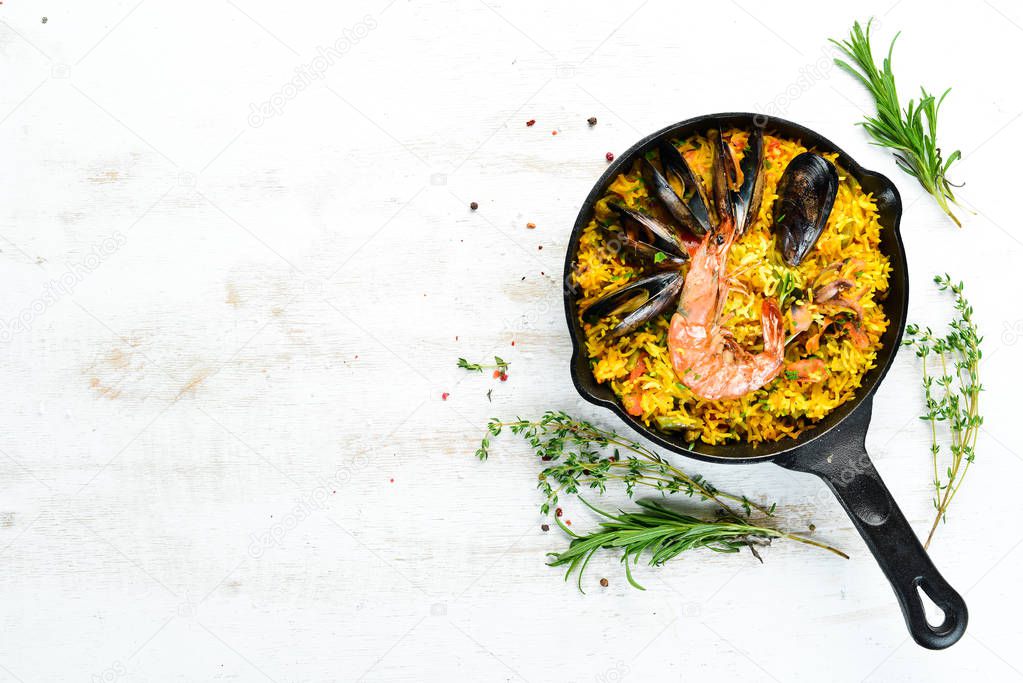 Seafood rice. Paella with mussels and shrimp. Top view. Free space for your text.