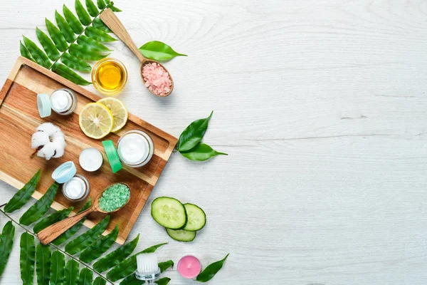 Natural face cream. Face Care. On a white wooden background. Flat lay.