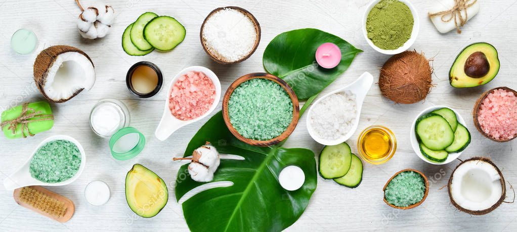 Natural Cosmetics: Avocado, coconut, sea salt and face cream. The concept of cosmetics and spa. Top view. Free copy space.