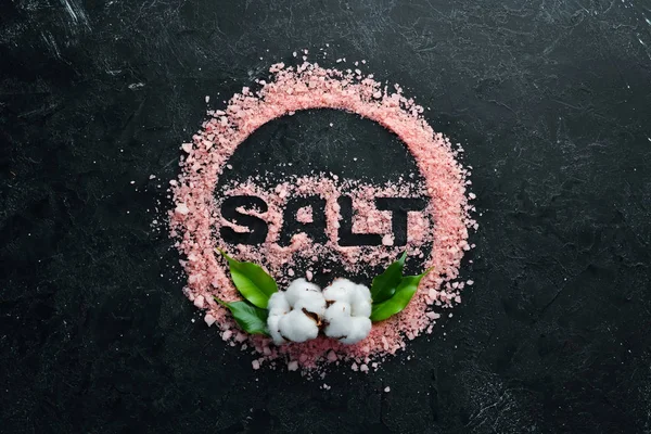 Cosmetic Pink Salt Inscription Salt Black Stone Background Spa Treatments — Stock Photo, Image