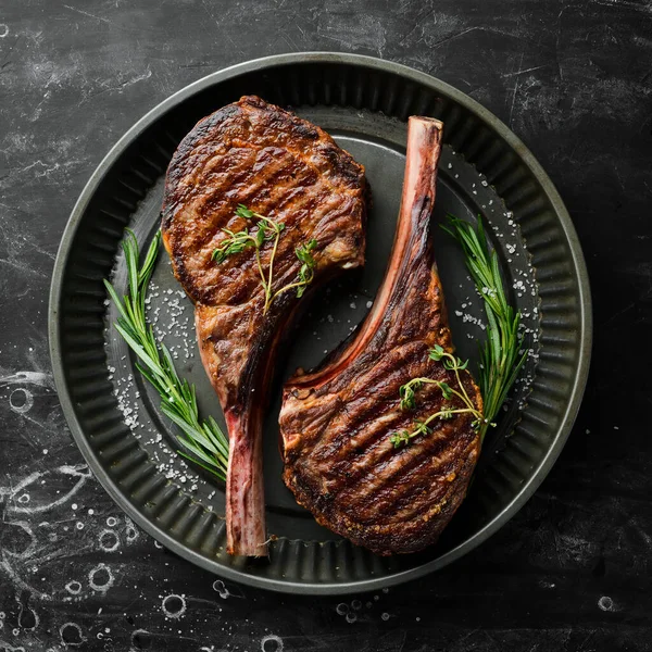 Juicy Steak Grilled Bone Spices Herbs Black Stone Background Top — Stock Photo, Image