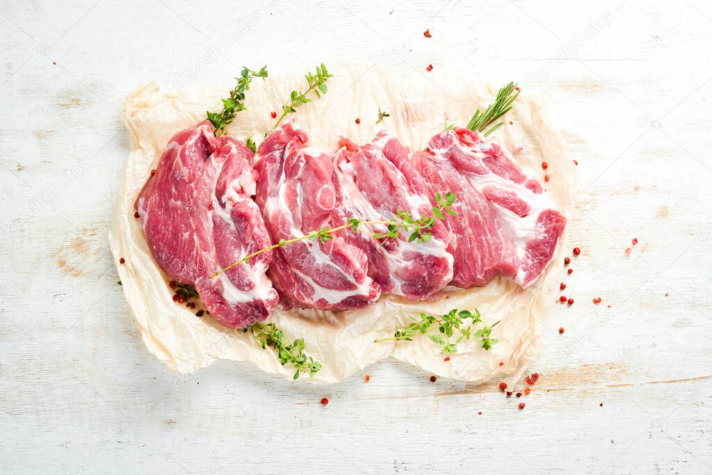Raw pork steak with spices. Meat. Top view. Rustic style.