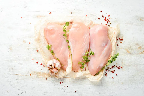 Meat. Raw chicken fillet with spices. Top view. Rustic style.